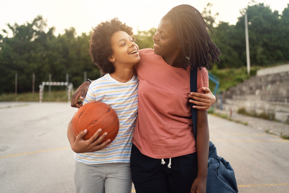 mother and daughter leaving basketball court