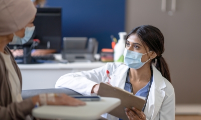 clinical trial female doctor talking to patient