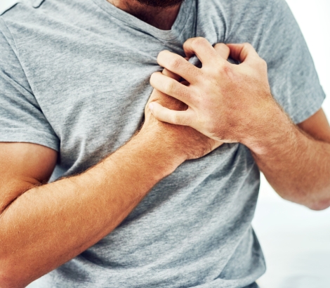 man suffering from chest pain