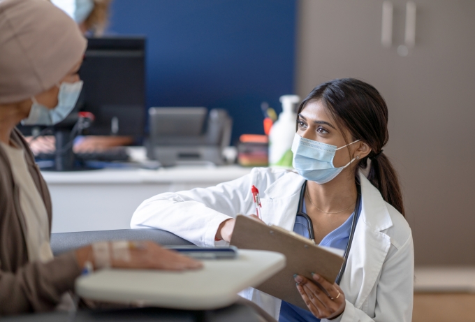 clinical trial female doctor talking to patient