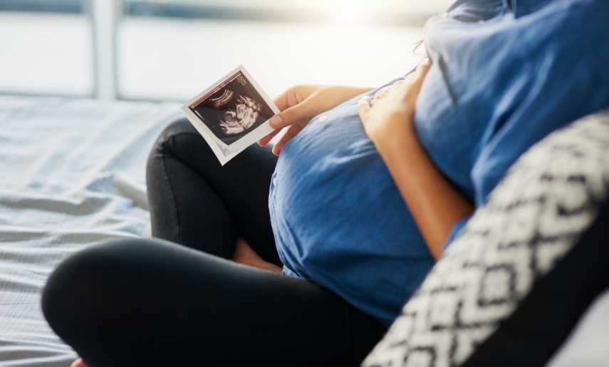 pregnant woman holding an ultrasound scan.jpg